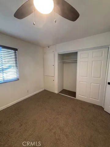 a bathroom with a sink mirror vanity and toilet