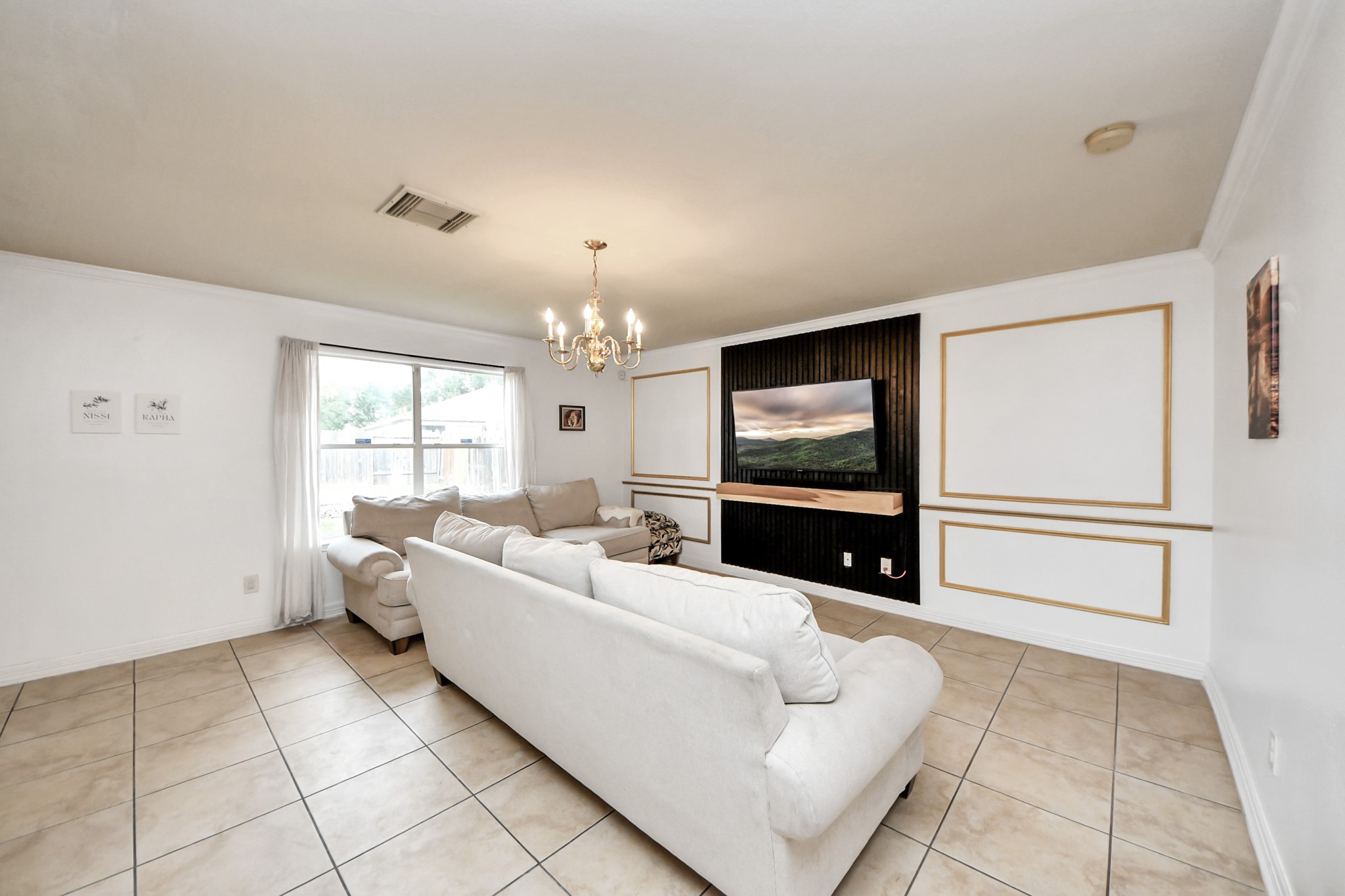 611 Remwick Drive Houston, TX 77073 - Photo 13 of 42 a living room with furniture and a flat screen tv
