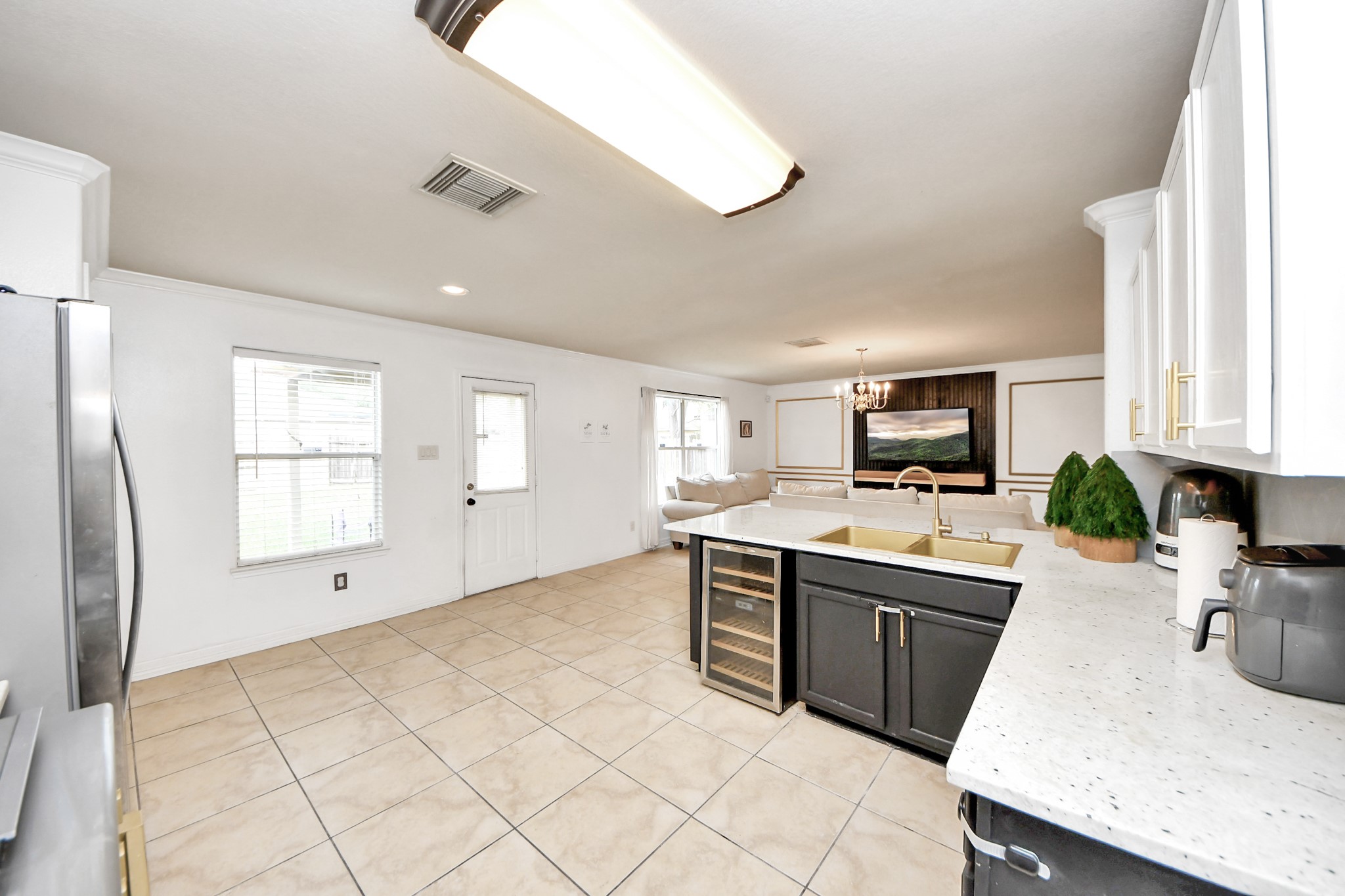 611 Remwick Drive Houston, TX 77073 - Photo 18 of 42 a large kitchen with white cabinets