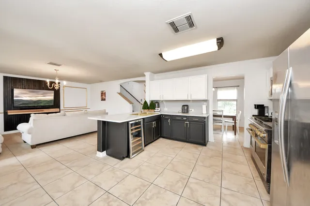 a kitchen with a stove a sink and a refrigerator
