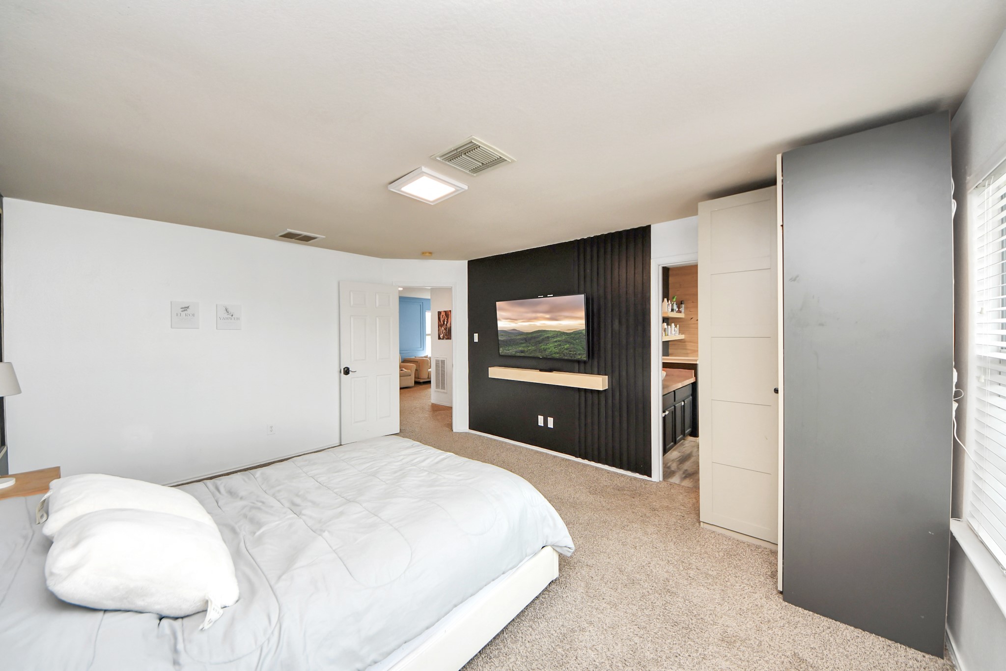 611 Remwick Drive Houston, TX 77073 - Photo 25 of 42 a bedroom with a bed and a large window