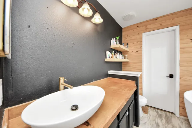 a bedroom with bed and a couch