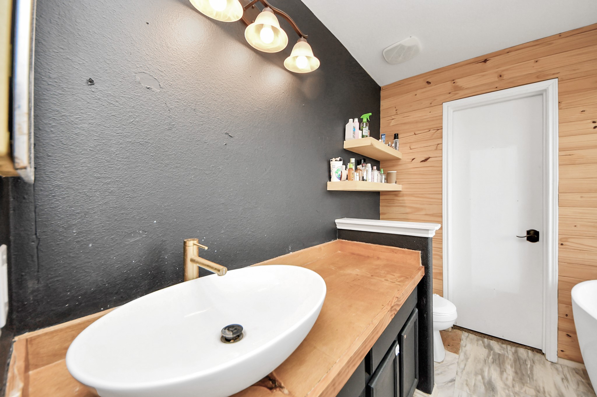 611 Remwick Drive Houston, TX 77073 - Photo 26 of 42 a bathroom with a sink and mirror
