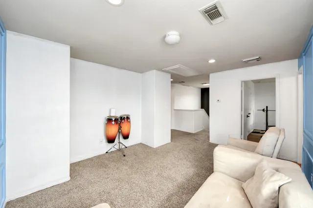 a bathroom with a granite countertop sink toilet and mirror
