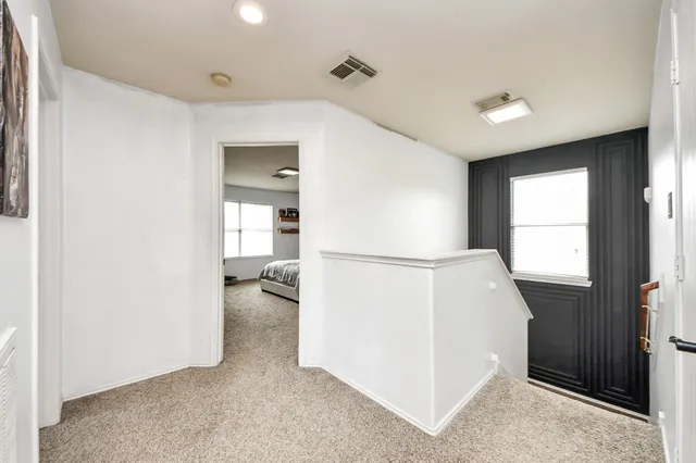 a view of a house with backyard and porch