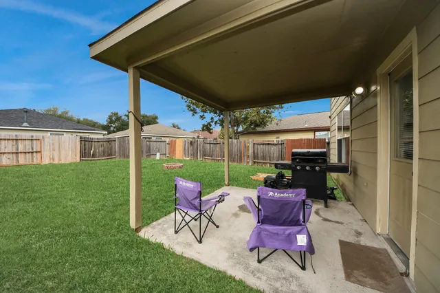an aerial view of a houses with outdoor space