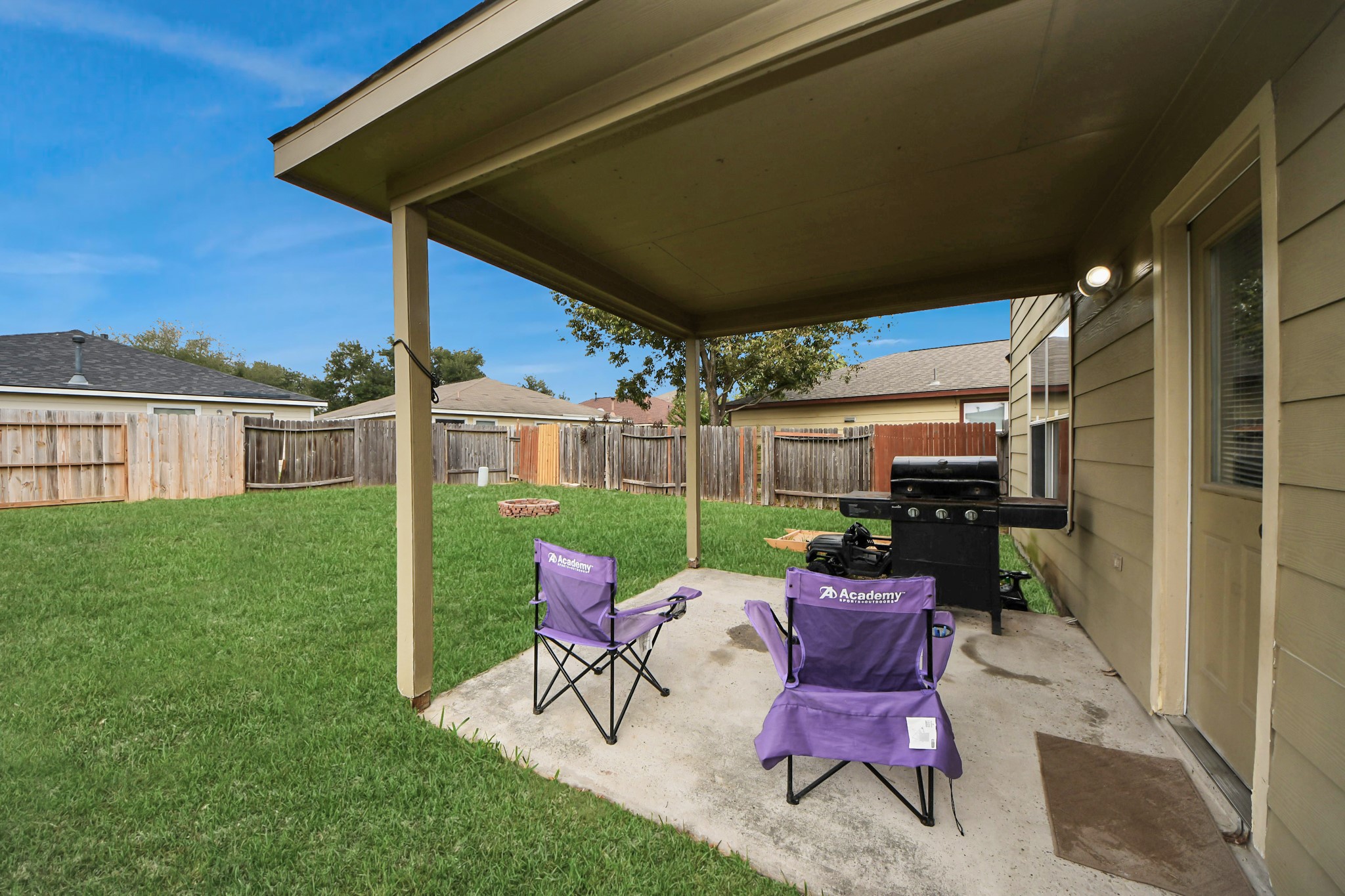 611 Remwick Drive Houston, TX 77073 - Photo 39 of 42 a view of a patio with table and chairs potted plants with wooden fence