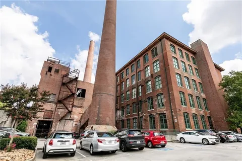 a view of a parked cars in front of a building