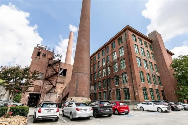 a view of a parked cars in front of a building