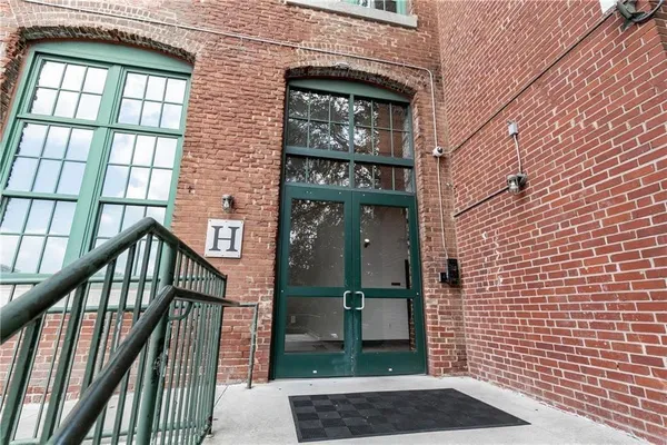 a view of a brick building and stairs