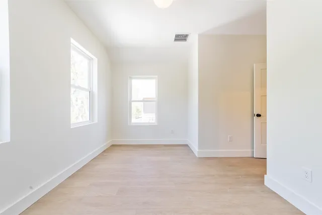 an empty room with windows