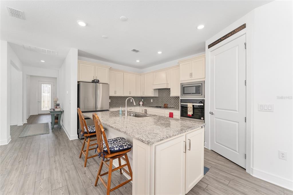 6034 Southwest 86th Circle Ocala, FL 34481 - Photo 13 of 59 a kitchen with stainless steel appliances granite countertop a refrigerator and a stove top oven