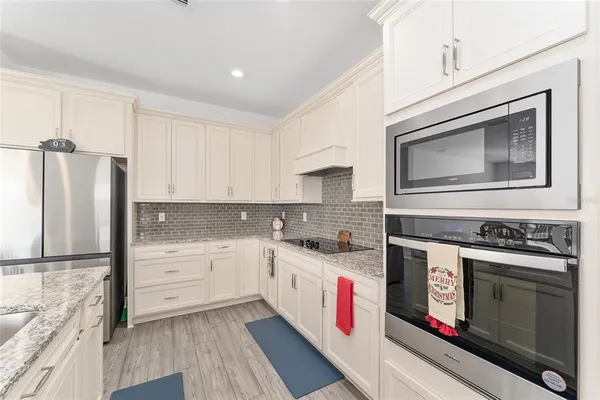 a kitchen with a sink and living room