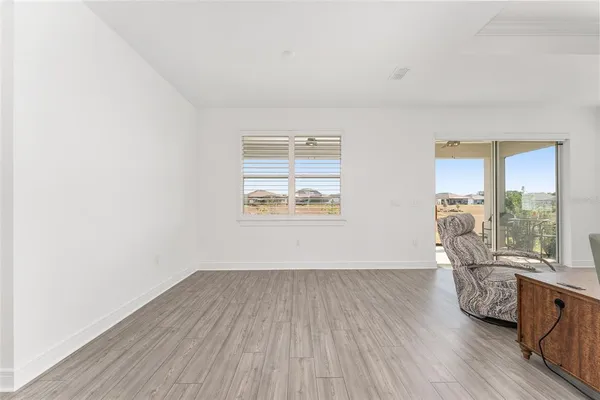 a bathroom with a granite countertop sink a large mirror and shower