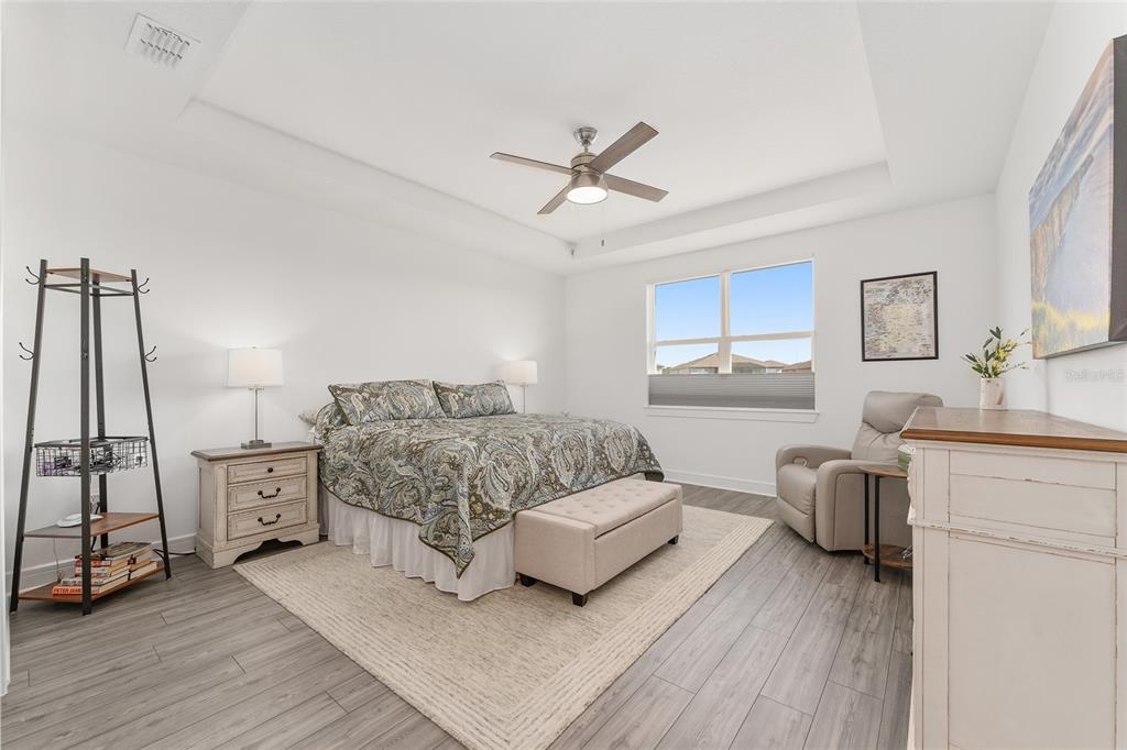 6034 Southwest 86th Circle Ocala, FL 34481 - Photo 20 of 59 a bedroom with a bed and wooden floor