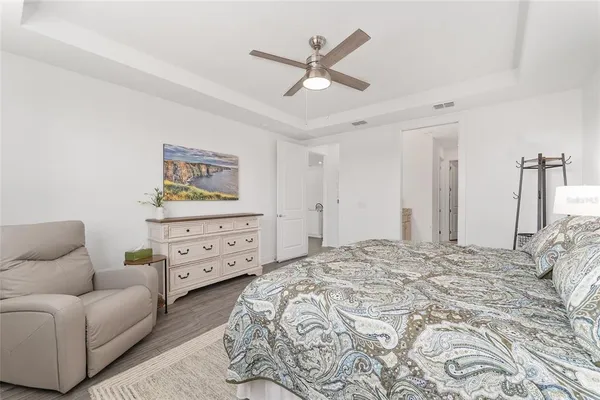 a bathroom with a granite countertop double vanity sink and mirror
