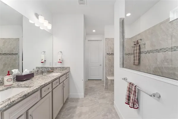 a room with a walk in closet and a bathroom