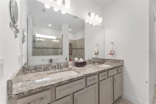 a room with a bed and a dresser