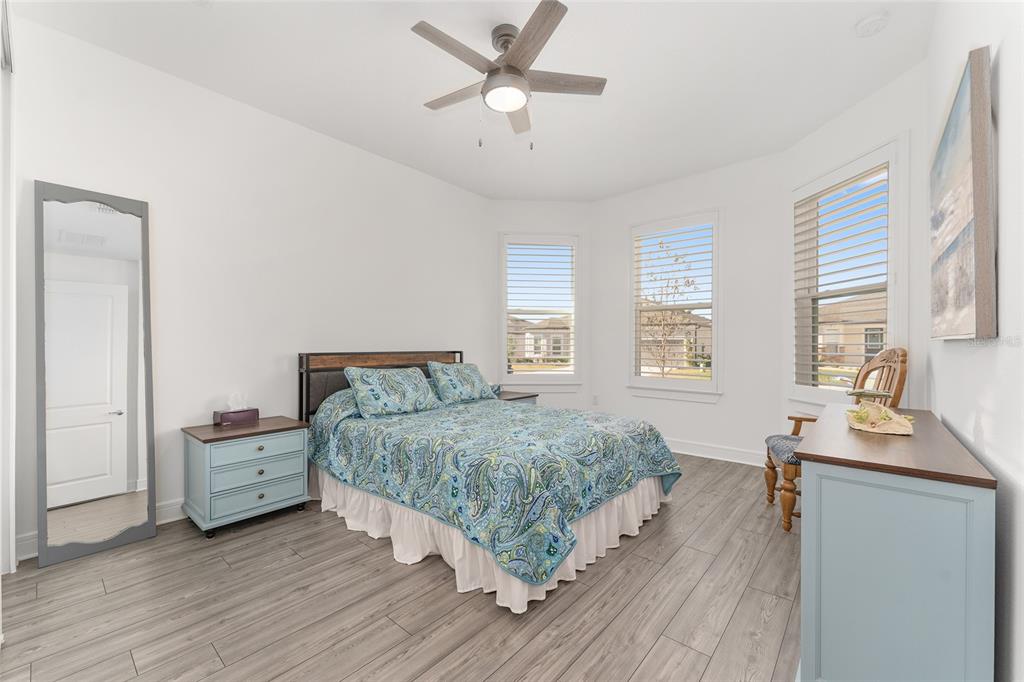 6034 Southwest 86th Circle Ocala, FL 34481 - Photo 27 of 59 a room with a bed and a dresser