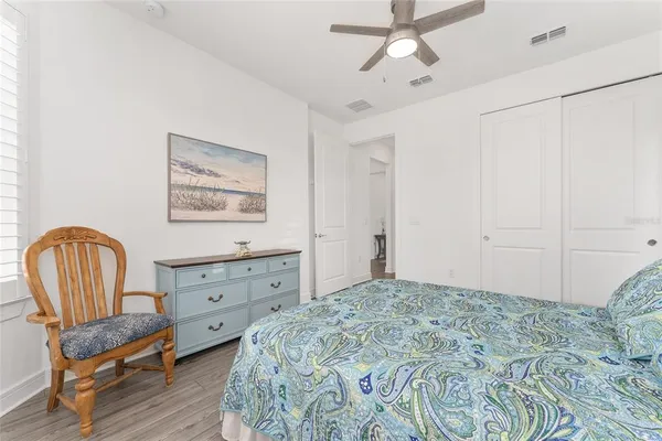a view of a workspace with furniture and wooden floor