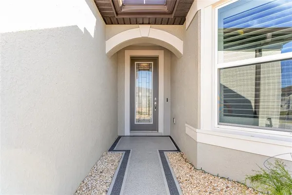 a view of a room with wooden floor and bench