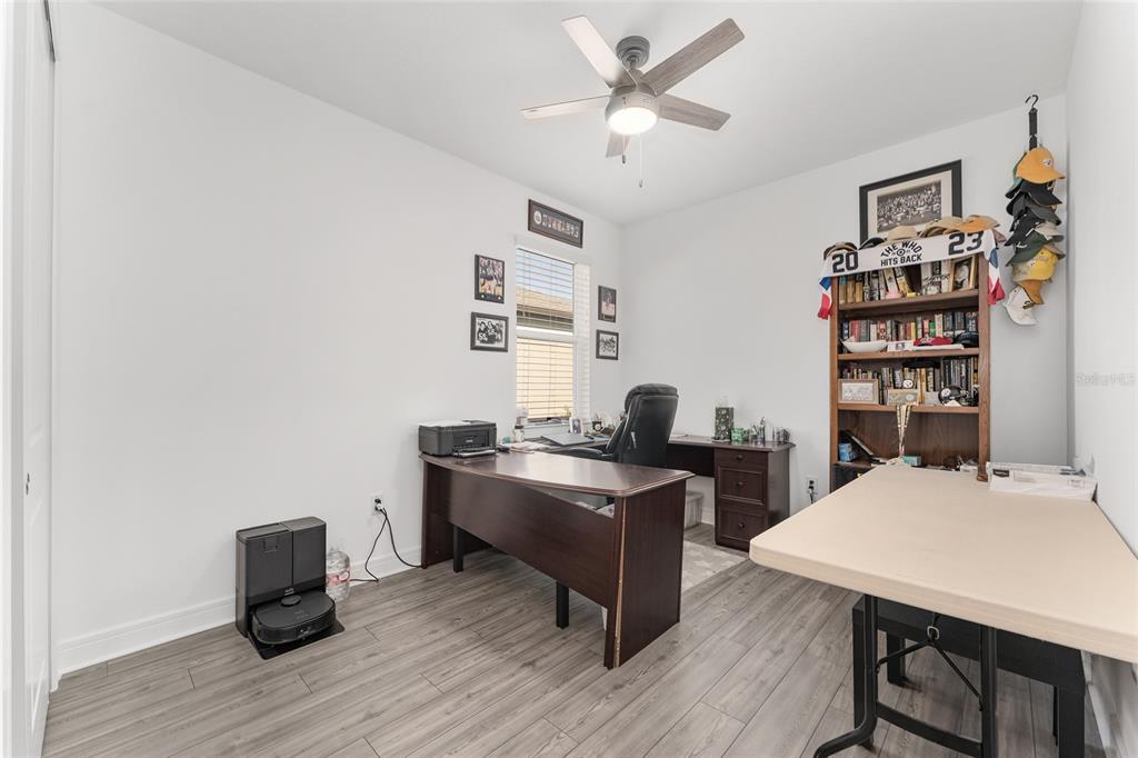 6034 Southwest 86th Circle Ocala, FL 34481 - Photo 31 of 59 a view of a workspace with furniture and wooden floor