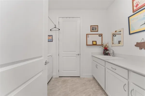 a living room with furniture and flowers