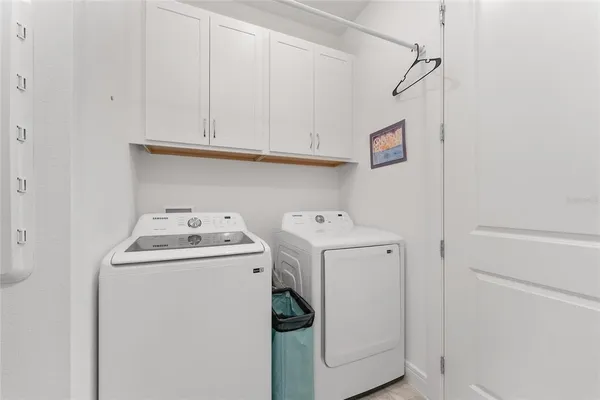 a view of a chairs and table in patio with a yard