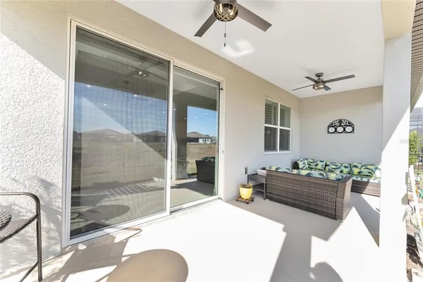 a view of a house with a big yard plants and large trees