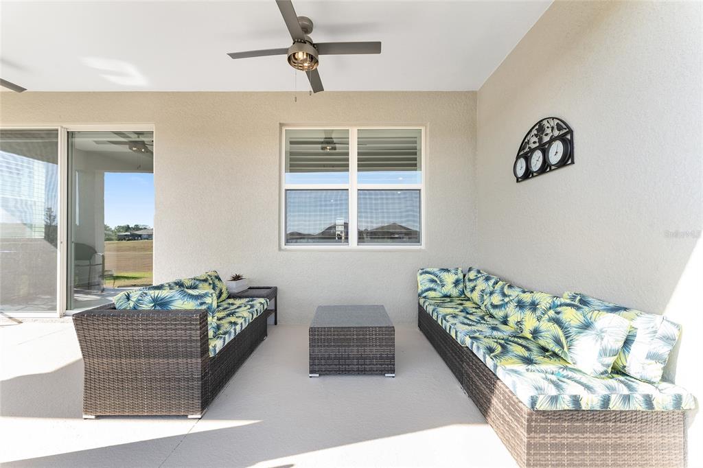 6034 Southwest 86th Circle Ocala, FL 34481 - Photo 39 of 59 a living room with furniture and flowers