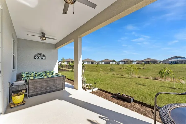 a view of a swimming pool with a yard