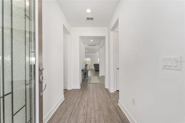 a view of a livingroom with furniture and wooden floor