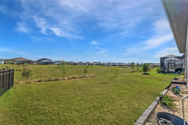an aerial view of a house with a swimming pool