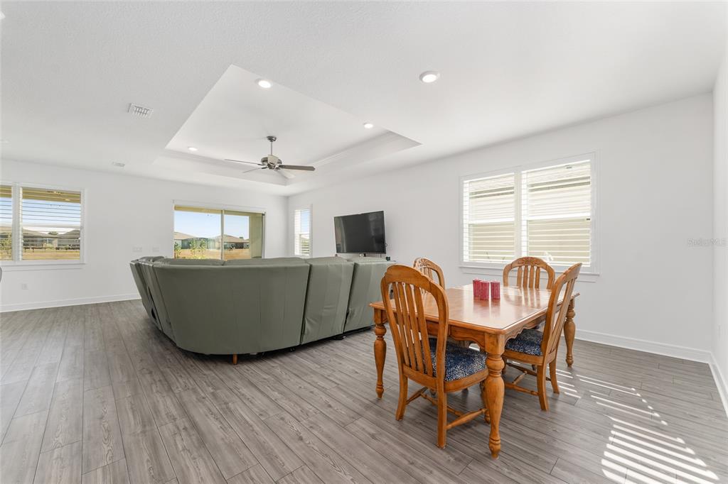 6034 Southwest 86th Circle Ocala, FL 34481 - Photo 8 of 59 a dining room with furniture and wooden floor