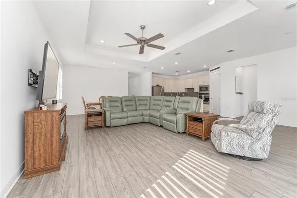 a kitchen with stainless steel appliances granite countertop a refrigerator and a stove top oven