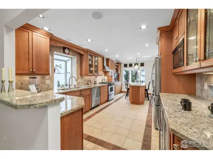 a living room with a bed furniture and a window