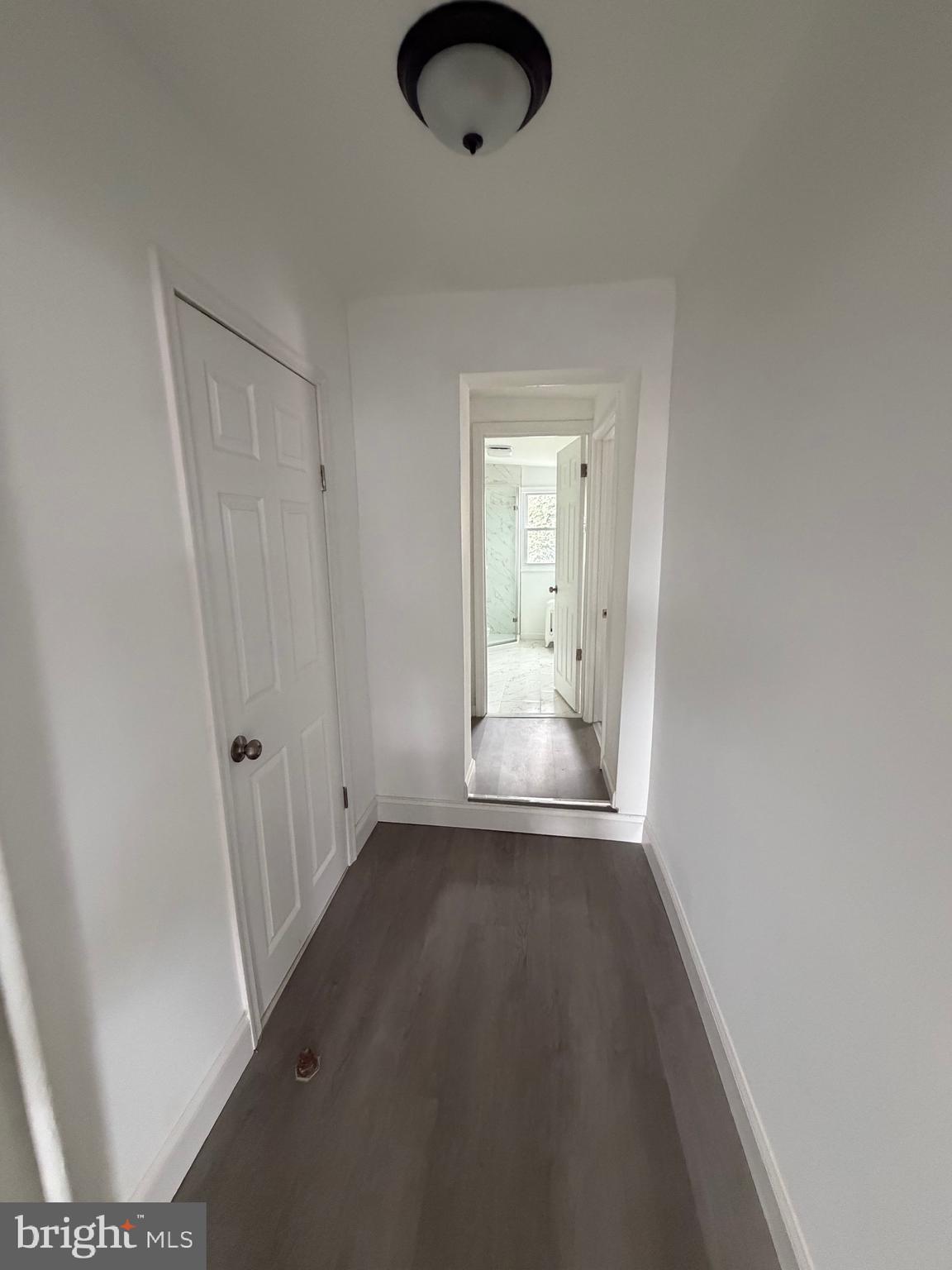 4148 Orchard Street Philadelphia, PA 19124 - Photo 15 of 25 a view of an empty room with wooden floor and a window