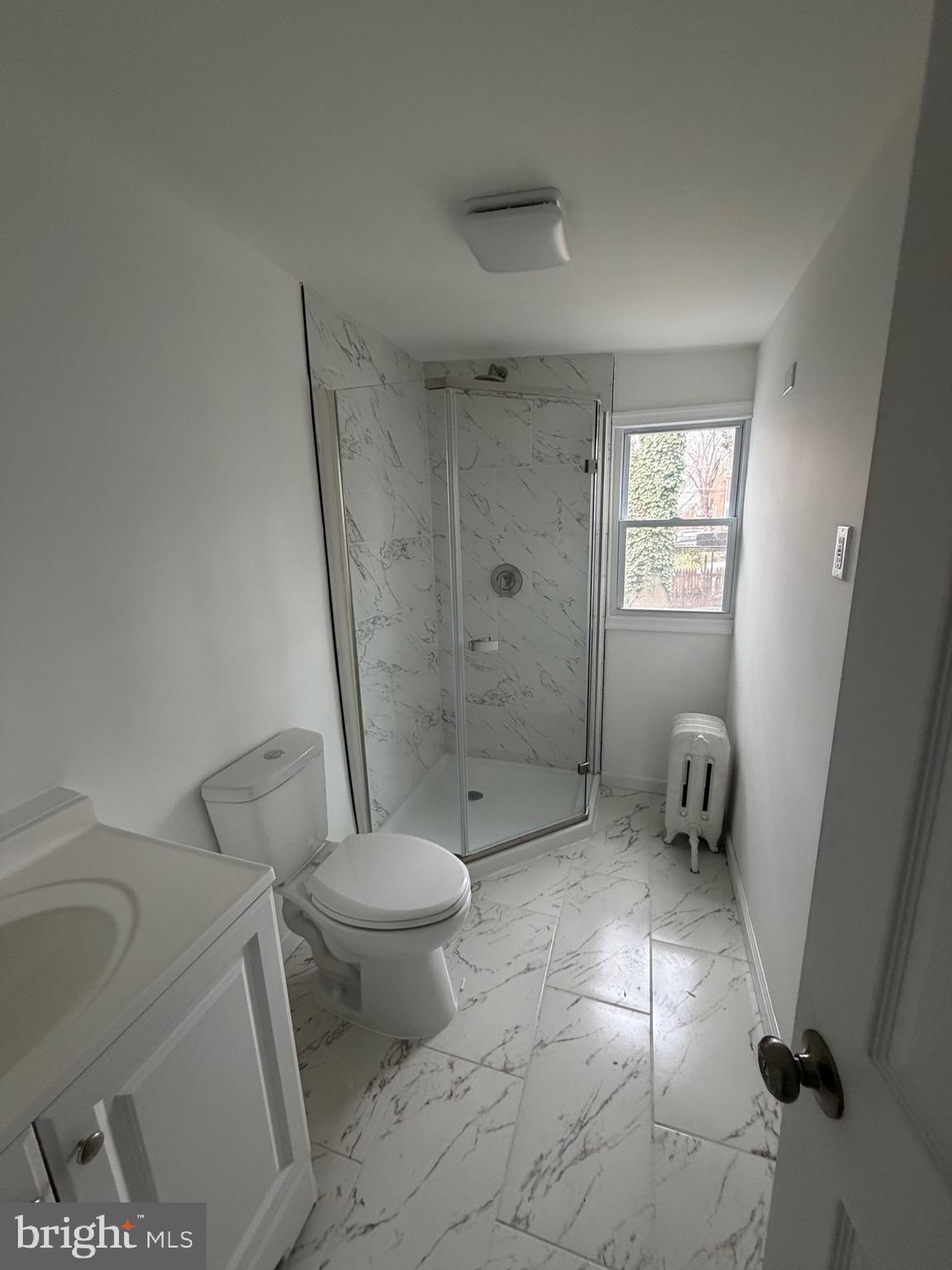 4148 Orchard Street Philadelphia, PA 19124 - Photo 16 of 25 a bathroom with a toilet and a shower