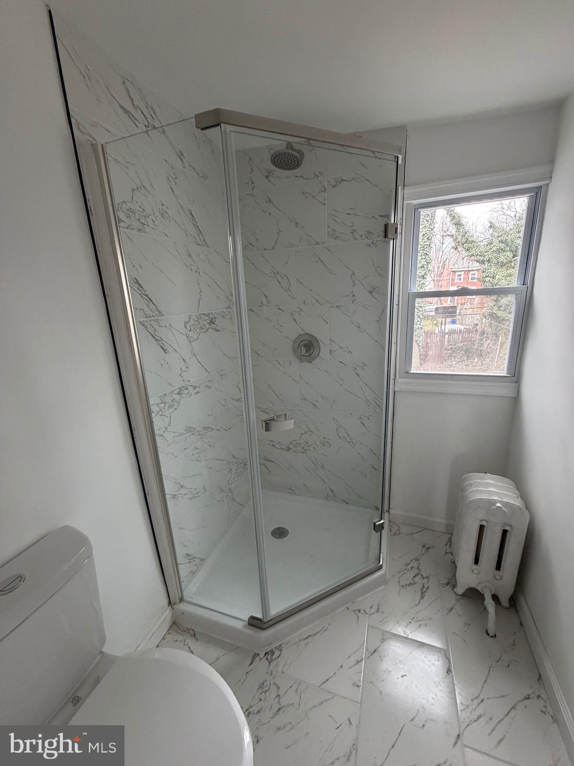 4148 Orchard Street Philadelphia, PA 19124 - Photo 19 of 25 a bathroom with a toilet and shower
