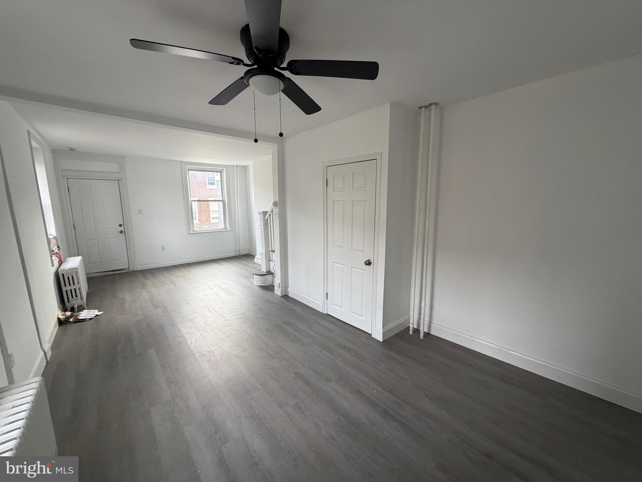 4148 Orchard Street Philadelphia, PA 19124 - Photo 7 of 25 an empty room with wooden floor and windows