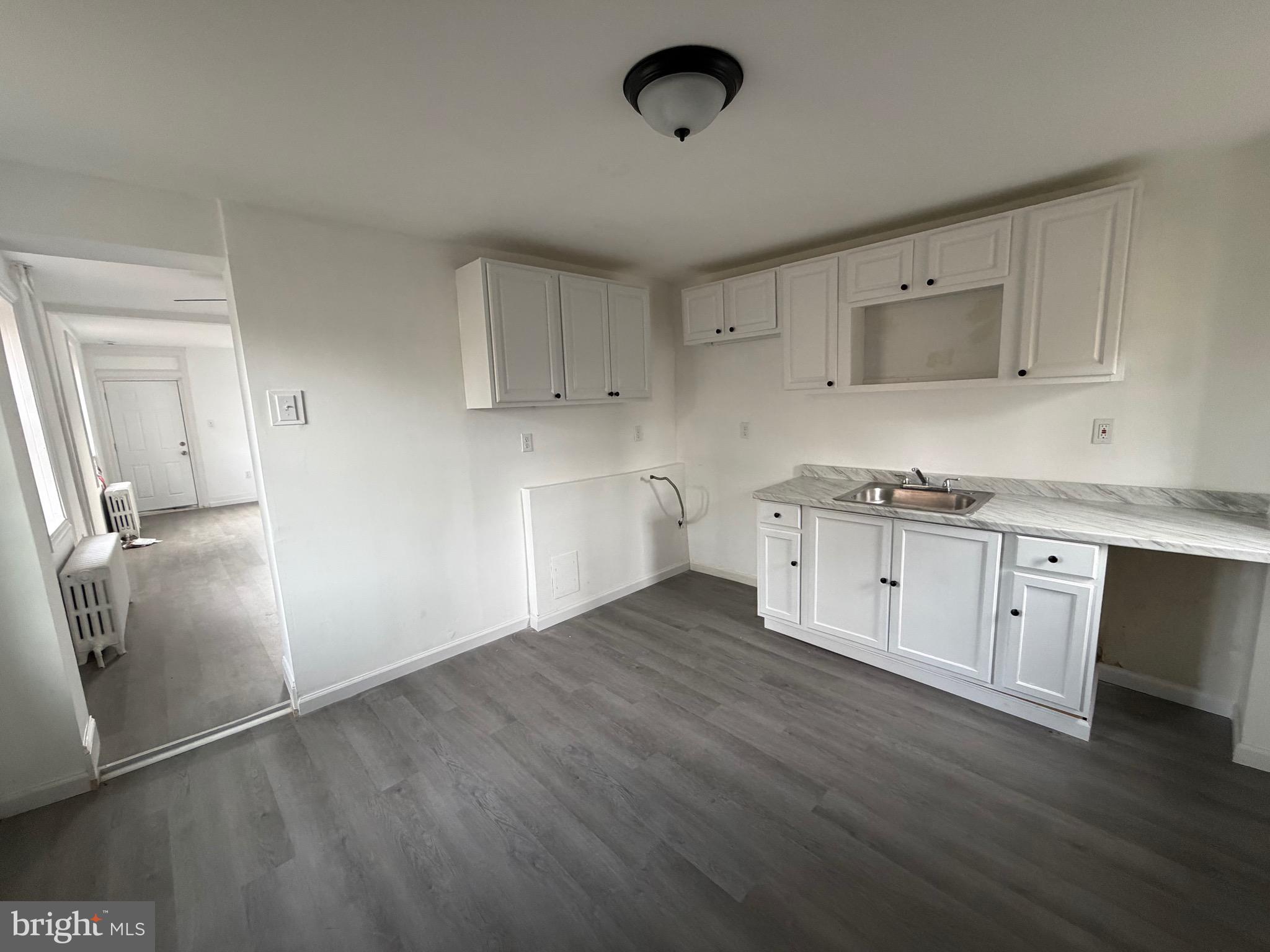 4148 Orchard Street Philadelphia, PA 19124 - Photo 9 of 25 a view of a kitchen with wooden floor