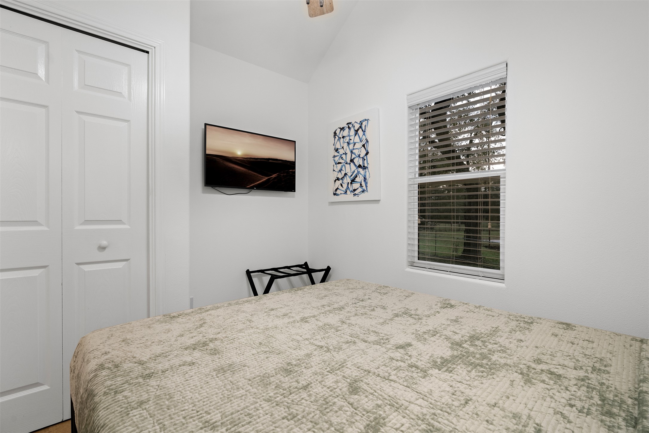1100 Live Oak Road Leander, TX 78641 - Photo 39 of 40 Bedroom featuring a closet, vaulted ceiling, and ceiling fan