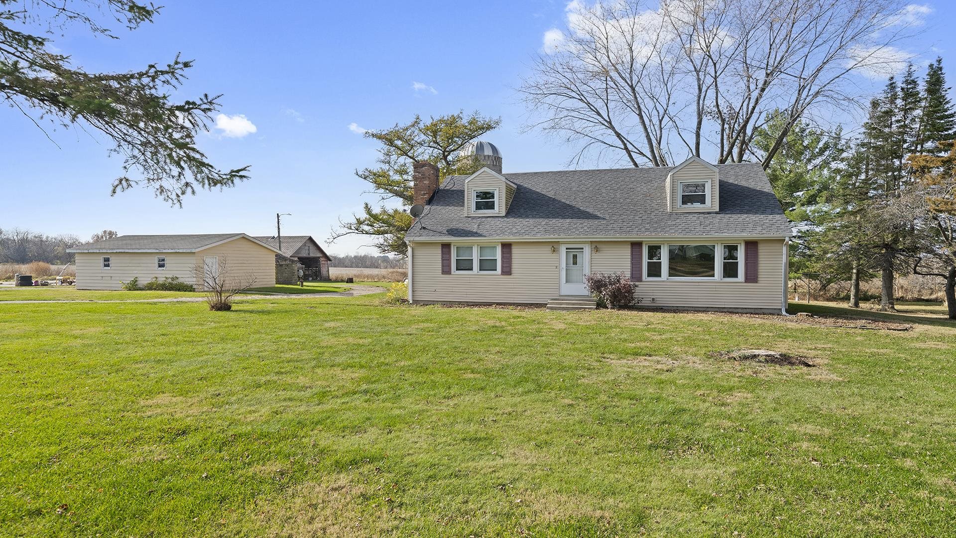 4303 Kendall Road Winnebago, IL 61088 - Photo 1 of 36 a front view of a house with garden