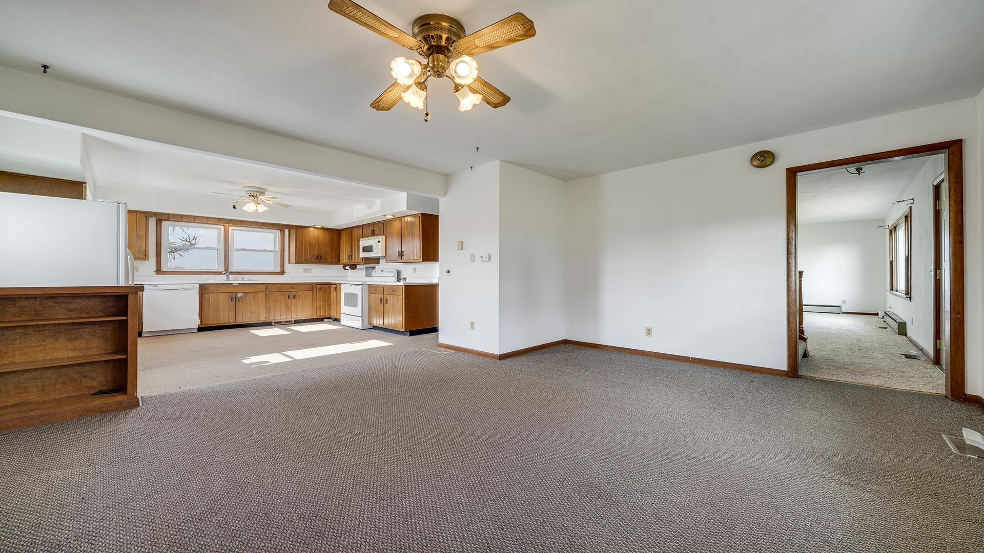 4303 Kendall Road Winnebago, IL 61088 - Photo 4 of 36 wooden floor in an empty room with a window