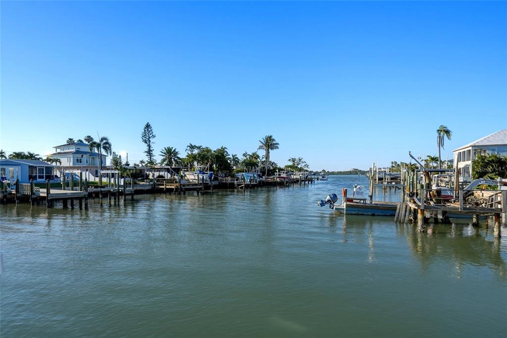 534 Crystal Drive Madeira Beach, FL 33708 - Photo 57 of 68 a view of a lake with boats and trees in the background