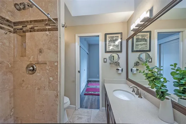 a bathroom with a tub and shower