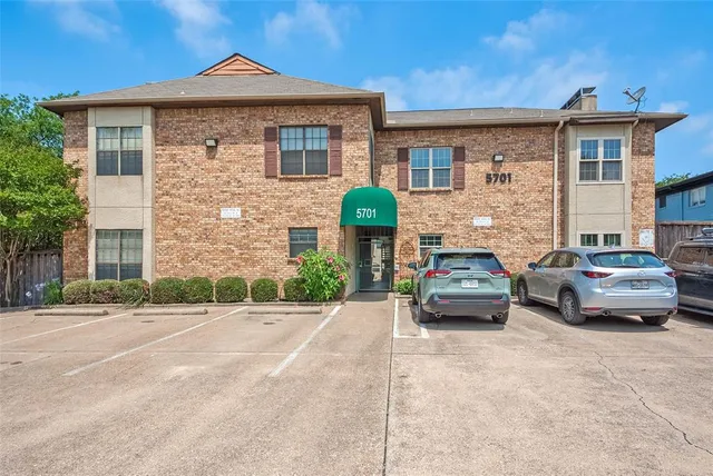 a car parked in front of a house