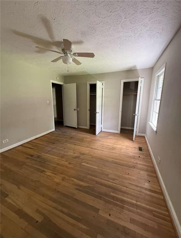 7205 Lakeview Drive Southwest Covington, GA 30014 - Photo 13 of 18 wooden floor in an empty room with a window