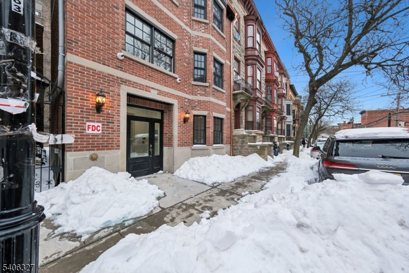 52 James Street, Unit 2 Newark, NJ 07102 - Photo 21 of 27 a view of a house with snow in the yard