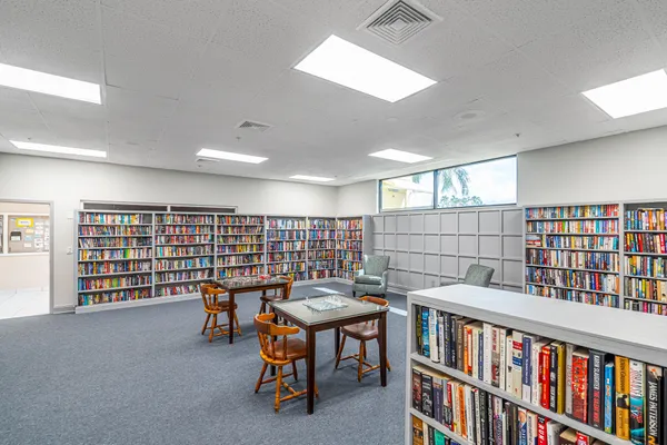 a reading room with furniture and book shelf